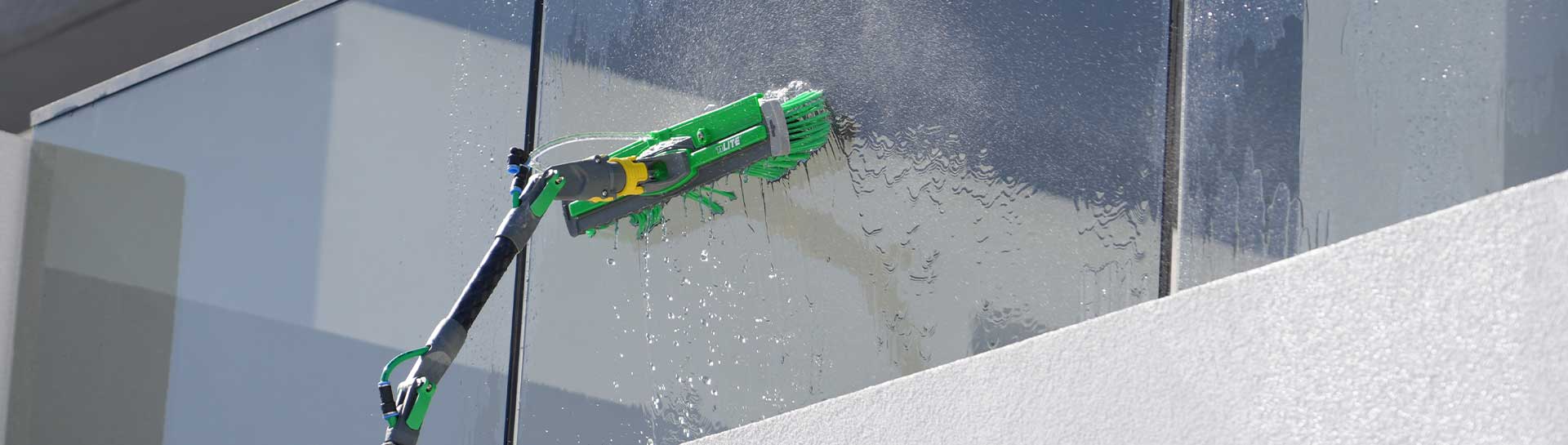 a close up of a ro water machine brush used to clean outdoor glass of a house