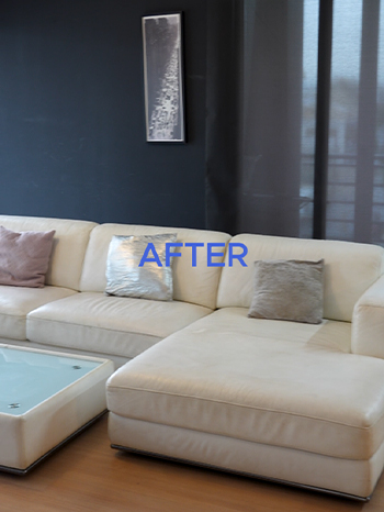 an after text on top of a clean, cream-colored sofa in a living room.