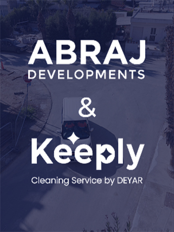 Drone view of residential street with branding for collaboration of ABRAJ Developments with Keeply cleaning service by DEYAR .