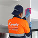 keeply employee cleaning the closets of a kitchen