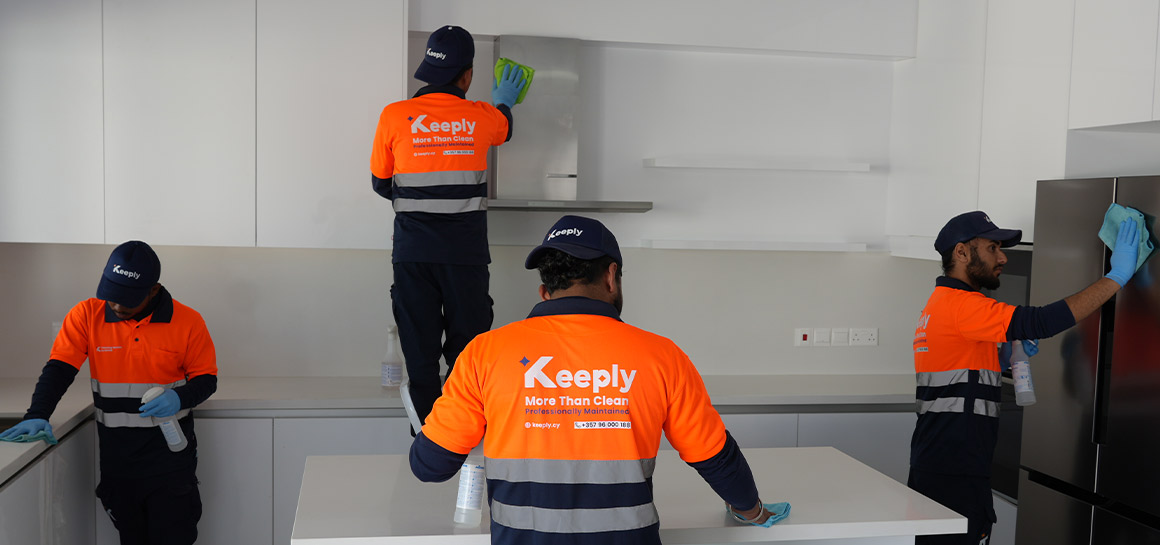 keeply employees in uniform cleaning a kitchen