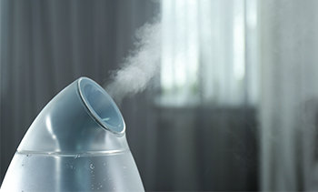 close up of an ozone ionization spray bottle spraying gas to clean the air.