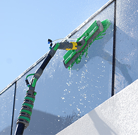 a close up of a ro water machine brush used to clean outdoor glass of a house.